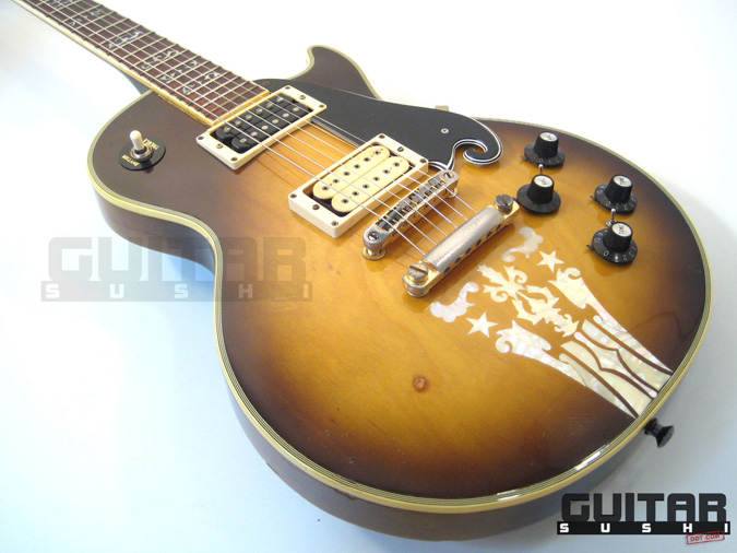 Vintage 1974 Ibanez Custom Agent Model 2405
Classic Pre-Serial Collectible Japanese Les Paul Style Lawsuit Era Electric Guitar with Urn Inlay Headstock, Creme Super 70 & Black DiMarzio pickups, and includes Hardshell Case [GUITAR SUSHI] Maintaining a wide-stance since 2006 | www.guitarsushi.com