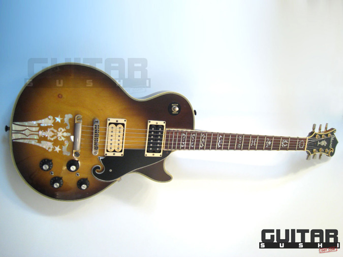 Vintage 1974 Ibanez Custom Agent Model 2405
Classic Pre-Serial Collectible Japanese Les Paul Style Lawsuit Era Electric Guitar with Urn Inlay Headstock, Creme Super 70 & Black DiMarzio pickups, and includes Hardshell Case [GUITAR SUSHI] Maintaining a wide-stance since 2006 | www.guitarsushi.com